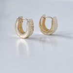Hoop earrings in 14K yellow gold.