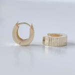 Hoop earrings in 14K yellow gold.