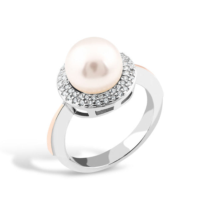 Silver ring with a pearl and cubic zirconia on a white background