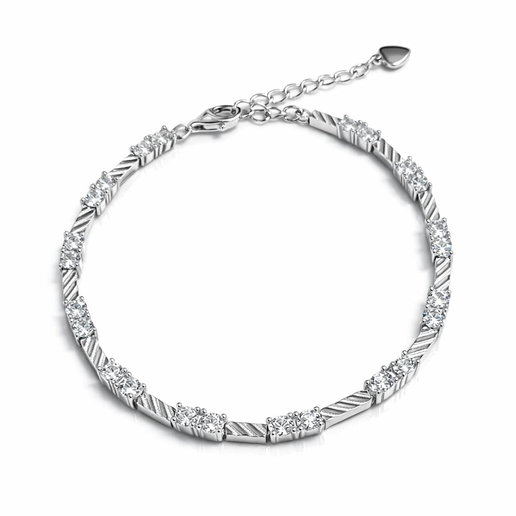 Silver bracelet with clear stones on a white background