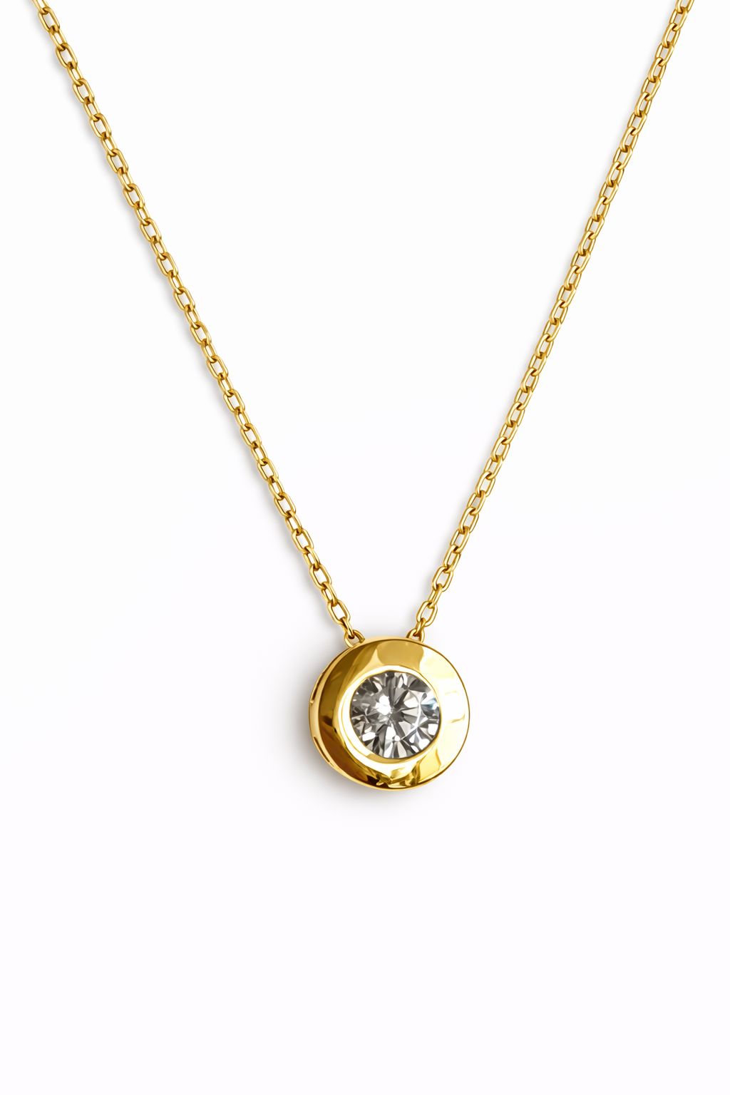 Gold necklace with cubic zirconia pendant on a white background
