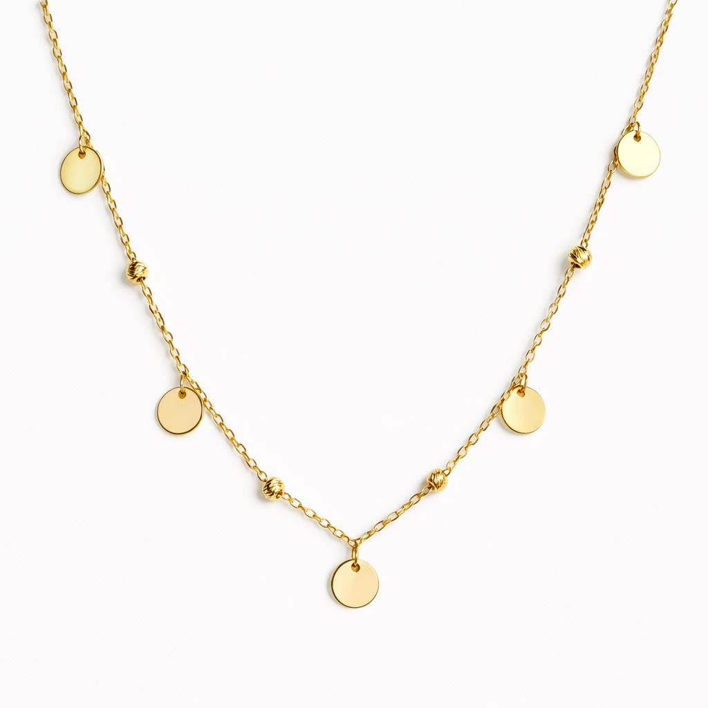 Gold necklace with round pendants on a white background