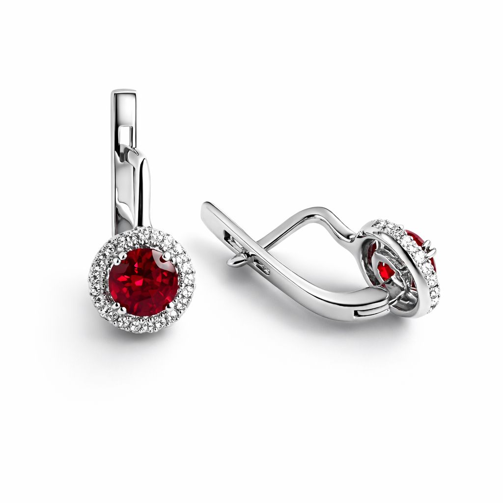 Sterling silver earrings with red garnet on a white background