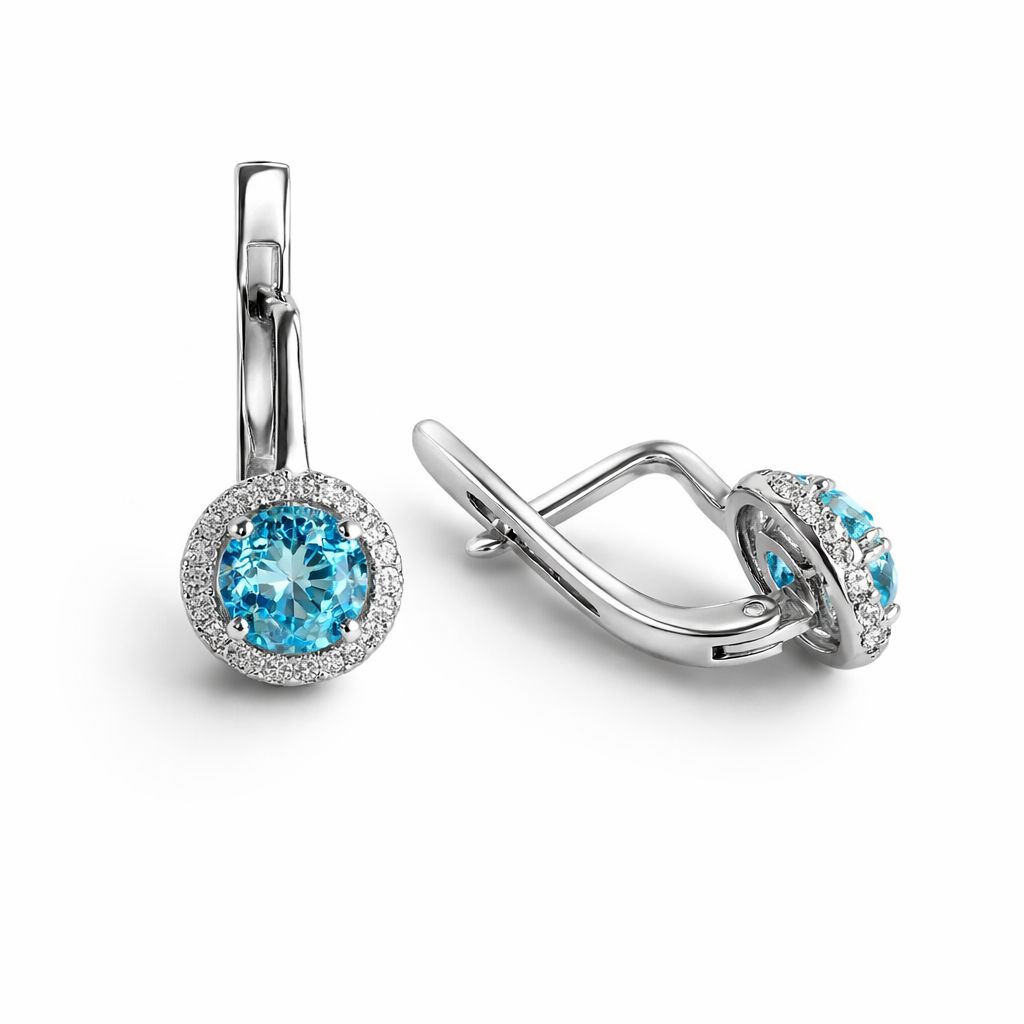 Pair of sterling silver earrings with topaz on a white background