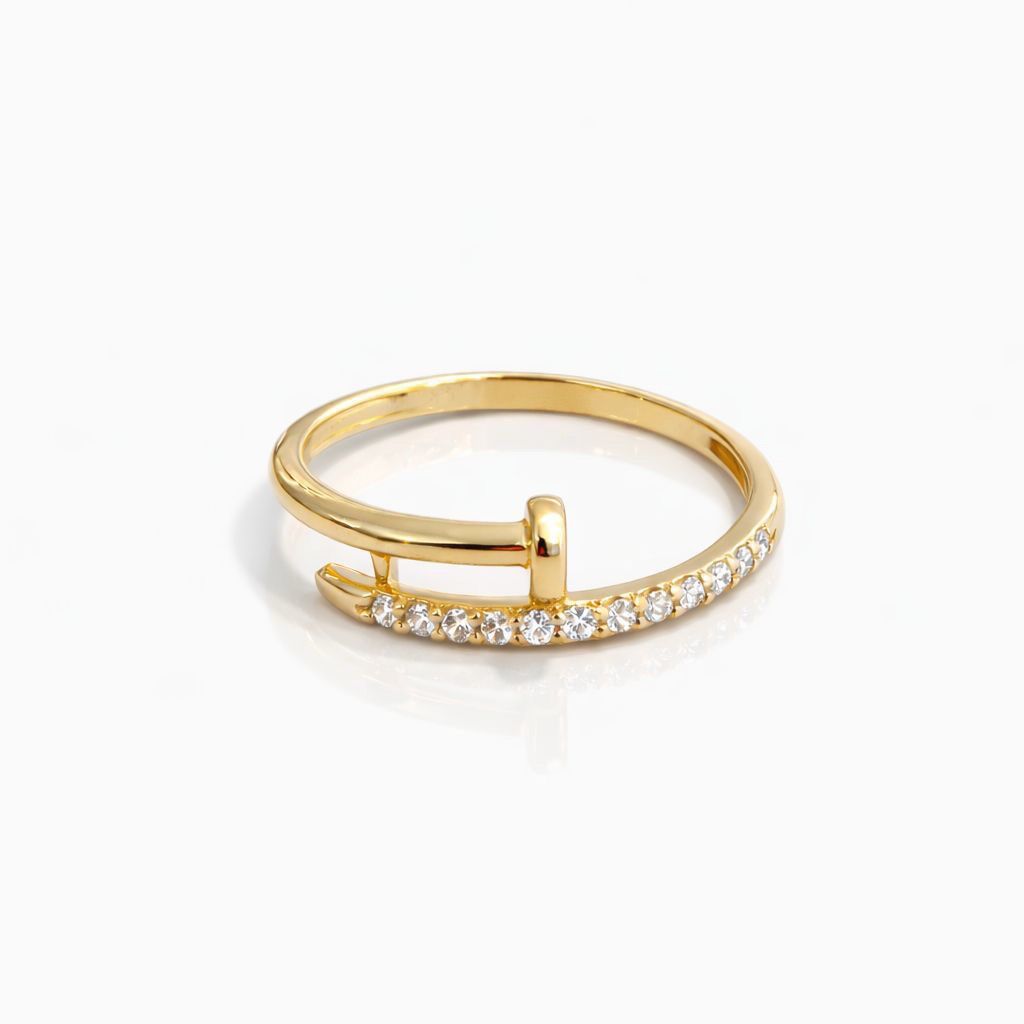 Gold ring with cubic zirconia on a white background