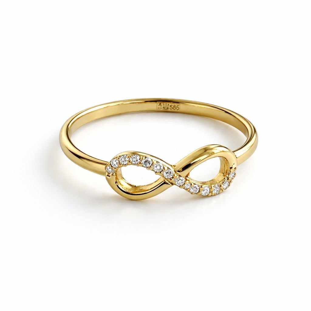 Gold infinity ring with cubic zirconia on a white background