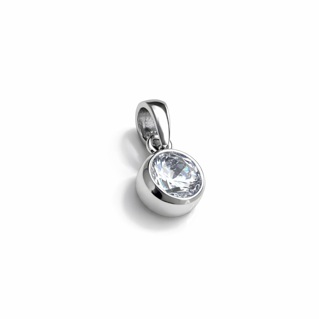 Sterling silver pendant with a clear cubic zirconia on a white background