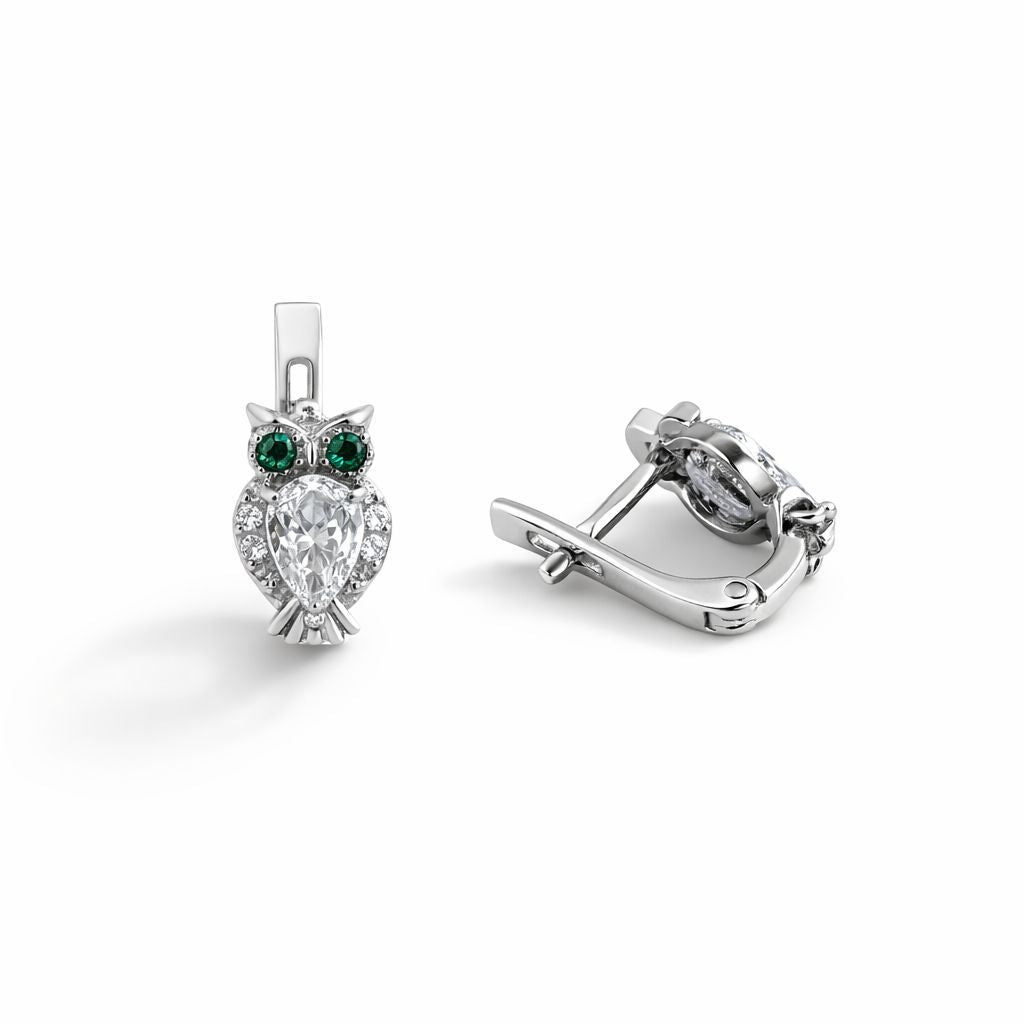 Sterling silver owl earrings with cubic zirconia on a white background