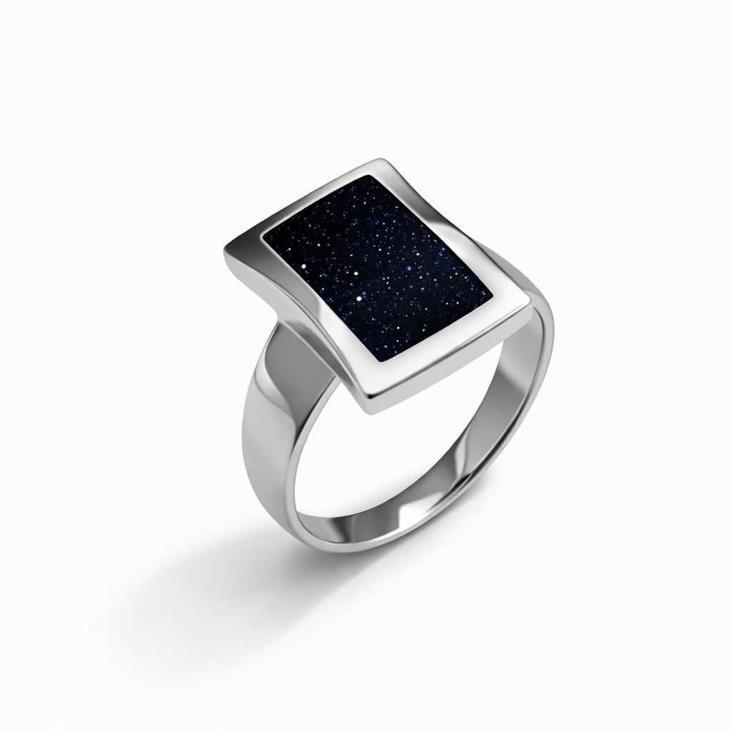 Sterling silver ring with aventurine on a white background