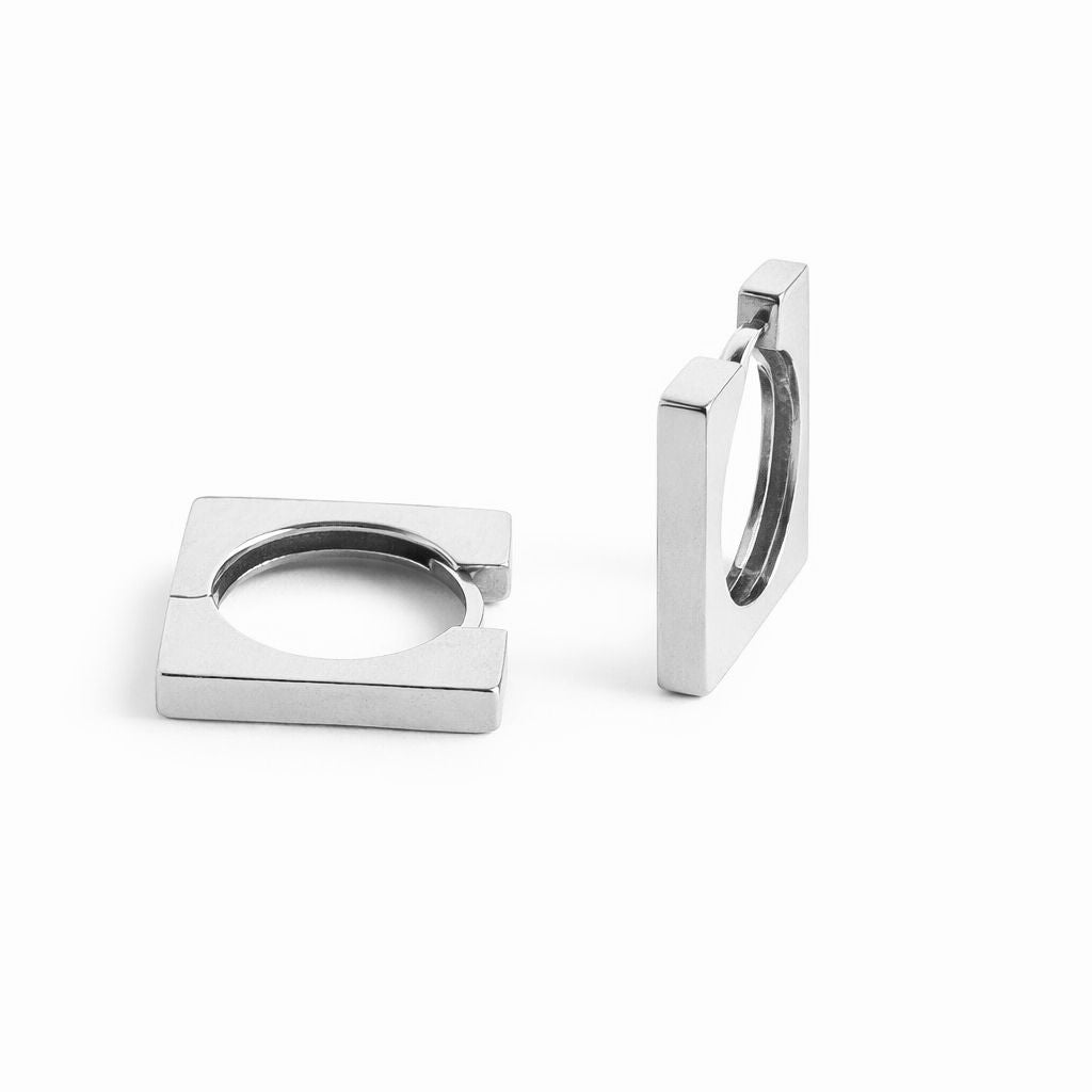 White gold hoop earrings on a white background