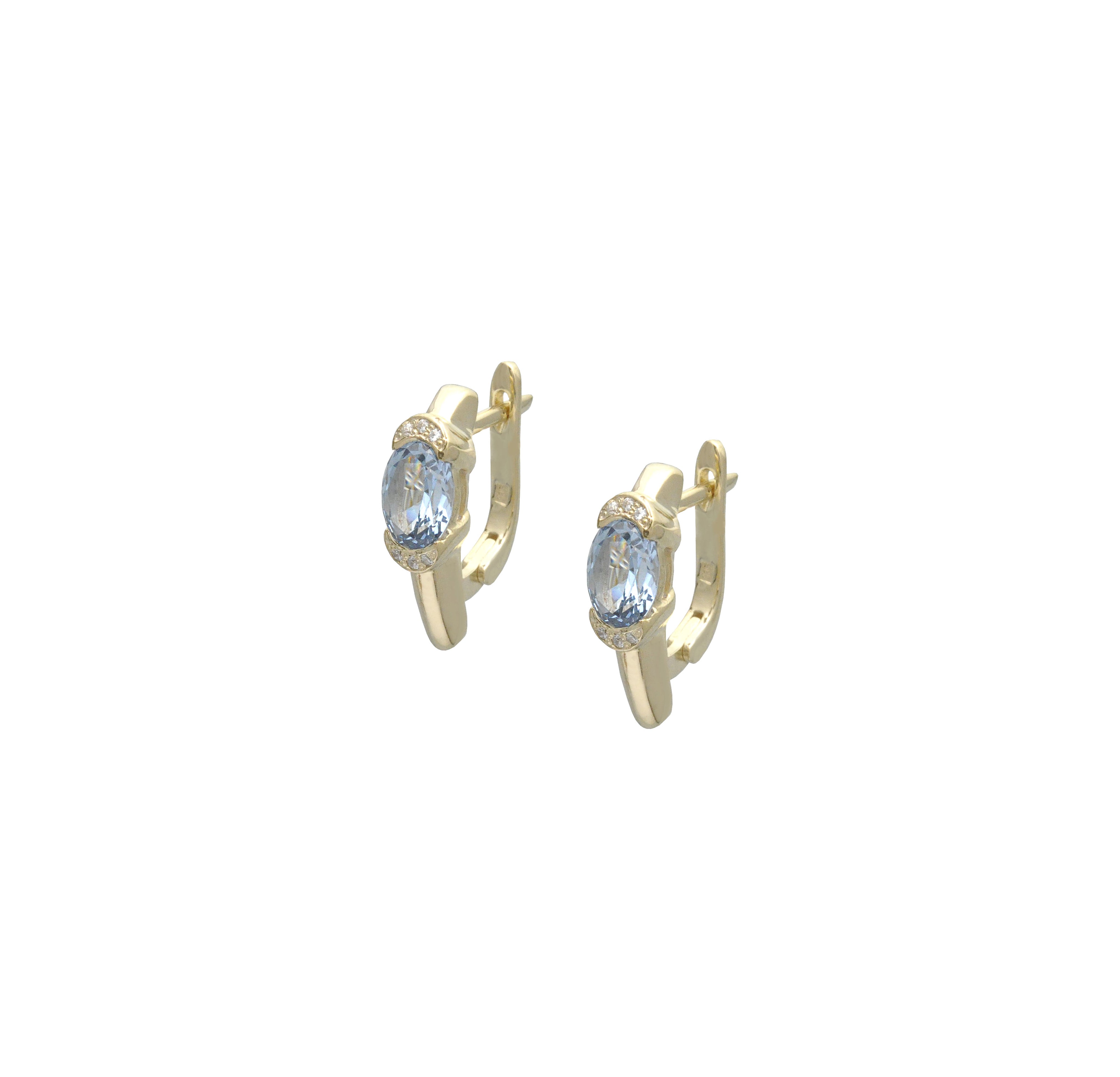 Lever back earrings in 14k yellow gold, decorated with oval topazes and diamond-cut zirconias.