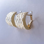 Lever back earrings in 14K yellow gold.